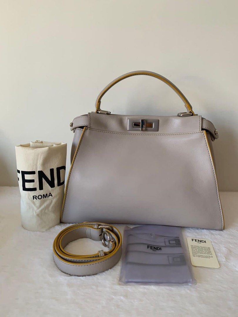 Fendi Peekaboo Medium Bag (Category: Luxury Bags & Wallets) located in Manila. Submitted by bagislifeshop (Listing ID 1213422772, Image 1). Description: ▪️Fendi Peekaboo Medium Bag▪️ ☑️Available in Pampanga ✅Condition: 8.5/10 ✅Material: Calf leather in PHW ✅Colour: Light gray and yellow ✅Inclusions: dustbag, raincoat and long strap .