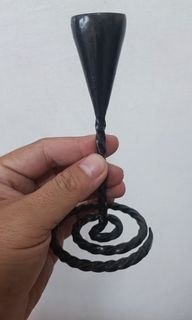 Metal candle holder with swirl stand design