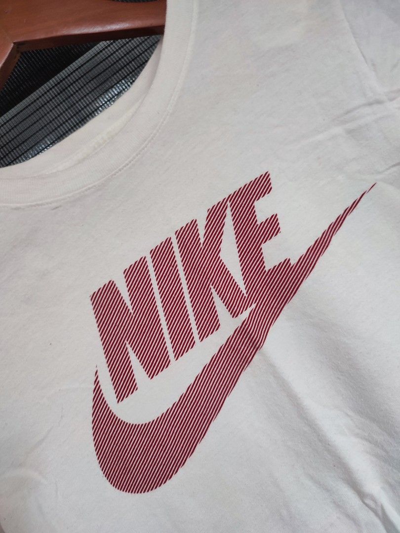 peach and white nike shirt