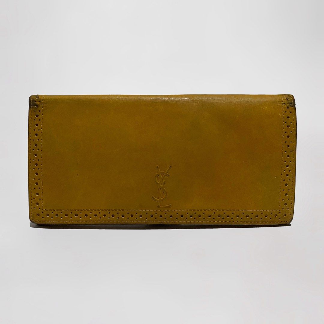 YSL Bifold long wallet (Category: Luxury Bags & Wallets) located in Bacolod City. Submitted by bt_ph (Listing ID 1213448087, Image 1). Description: Authentic YSL long wallet YSL embossed outer design 4 card compartments 1 zip compartment 2 paper bill compartments ykk zip YSL markings Minor sign of usage only.