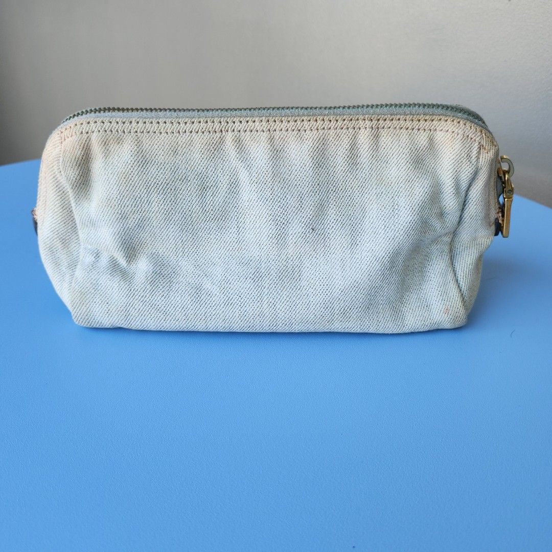 Authentic Prada denim pouch (Category: Luxury Bags & Wallets) located in Pasig City. Submitted by kitsch_closet (Listing ID 1213591235, Image 3). Description: Authentic Preloved Prada denim pouch with slight discoloration minor signs of use.