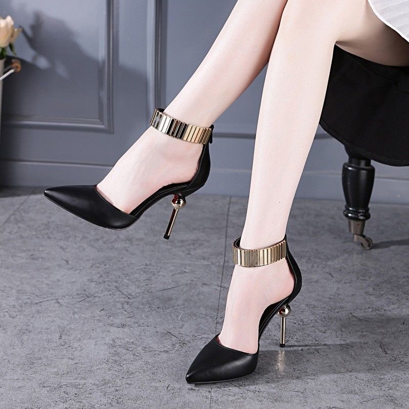 Gold and black stilettos top