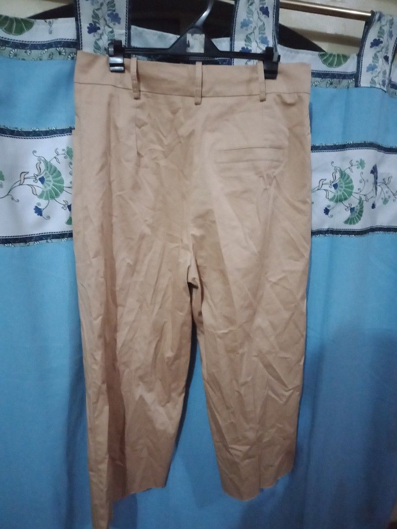 Cream Brown Straight Pants (Category: Other Bottoms) located in Paranaque City. Submitted by _andreaaaa13 (Listing ID 1213764552, Image 3). Description: Cream Brown Straight Pants - In good condition - Altered bottom part Size Frame: Medium to Large.