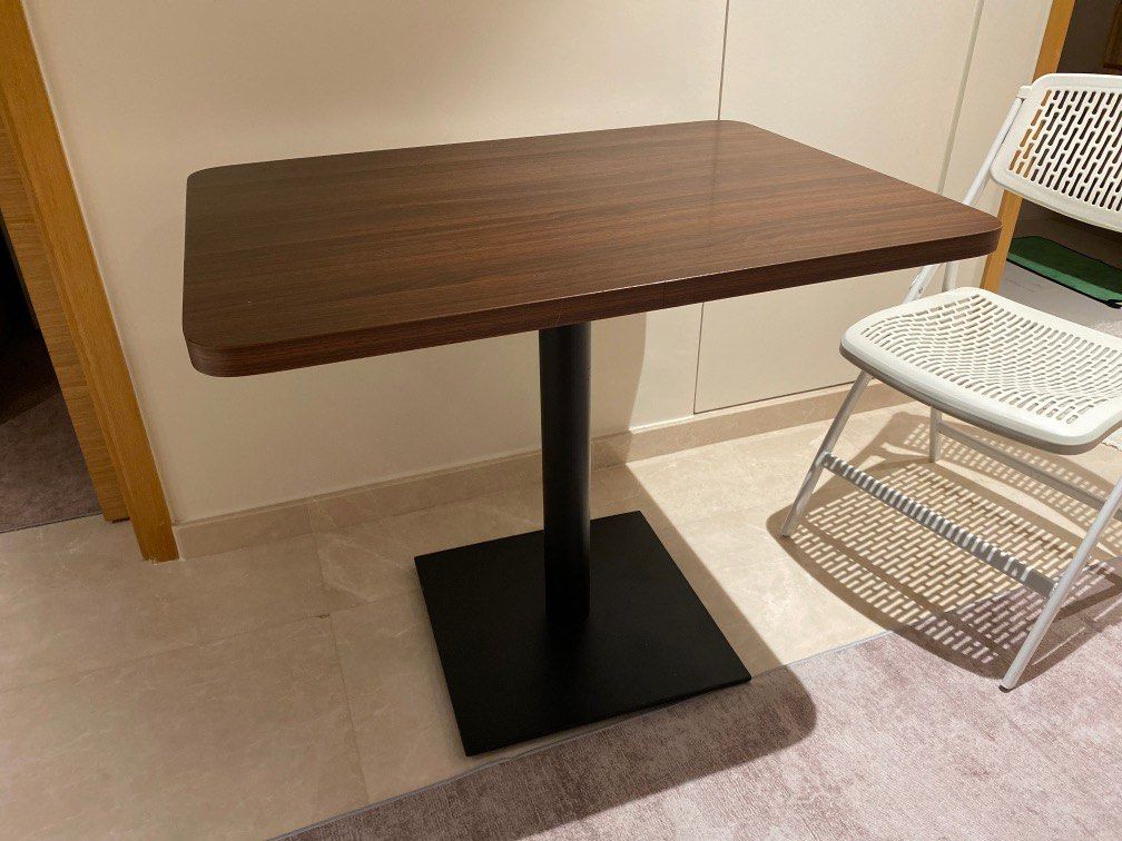 Dining Table (Category: Tables & Sets) located in Singapore. Submitted by epicfish.218714 (Listing ID 1213735716, Image 1). Description: 90x65x75. Solid and heavy with metal base. Note that base is slightly not aligned parallel to table Will help to deliver once confirmed.