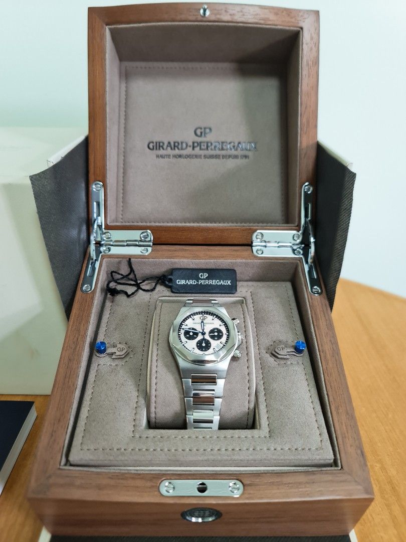 Girard Perregaux Laureato Chronograph 38mm (Category: Watches) located in Singapore. Submitted by timewonders (Listing ID 1205226877, Image 2). Description: GP Laureato Chronograph 38MM Model : 81040-11-131-11A Dial size : 38mm with stamped Clous de Paris pattern Bracelet : 904l Thickness : 11mm Movement : GP 3300-0135/38 calibre 4hz frequency with 46 hour power reserve Full set with brand new leather strap, rubber strap & deployment clasp.