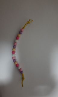 A hand-made bracelet that contains beads and a yellow rope, in addition to a ribbon that you can use to determine the size of your hand
To order any bracelet or necklace, message me
veememma@gmail.com