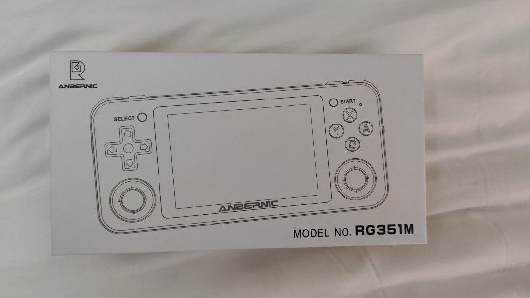 Anbernic RG351M - Retro Gaming Handheld (Category: Others) located in Mandaluyong City. Submitted by smaams (Listing ID 1213929262, Image 1). Description: For Sale: Anbernic RG351M (black metal body) Can load roms from: Atari Nes/Family Computer GB Game Gear WonderSwan Genesis Snes PSX N64 PSP (only light roms) Mame(fbneo) Certain old PC ports Comes with: -Stock SD micro card with stock OS (emuelec) Issues: -Down button symbol is deformed but all