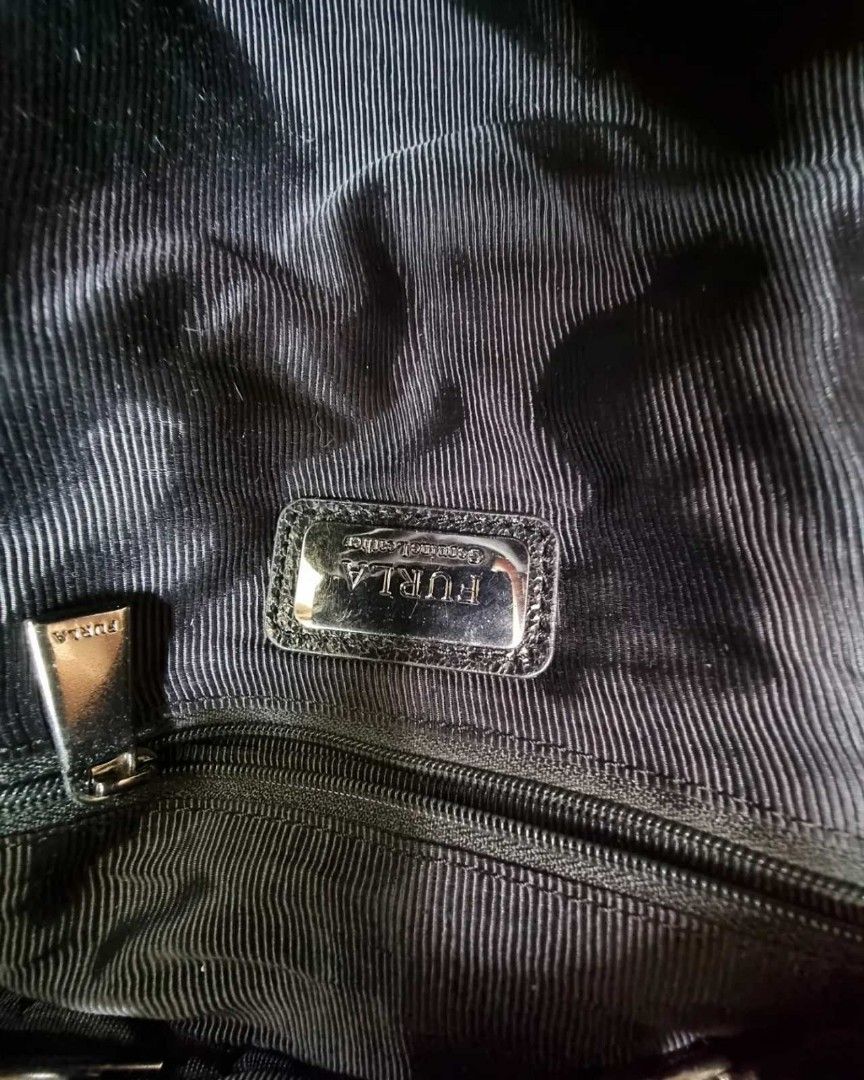 Authentic FURLA backpack mini (Category: Luxury Bags & Wallets) located in Quezon City. Submitted by manerarestorationservices (Listing ID 1213894464, Image 3). Description: SALE SALE SALE❗️❗️❗️10,500php 🧼🧿8,800PHP🧿🧼 Money back Guarantee 💯% Guaranteed authentic *Brand: FURLA *Color: BLACK CALFSKIN *Size: MINI *Condition: 8/10 HAS NEVER BEEN SPA -Used * Inclusions: BAG WITH PROVIDED Dustbag 10 : Brand-new or New with tag 9 : Like new,only use