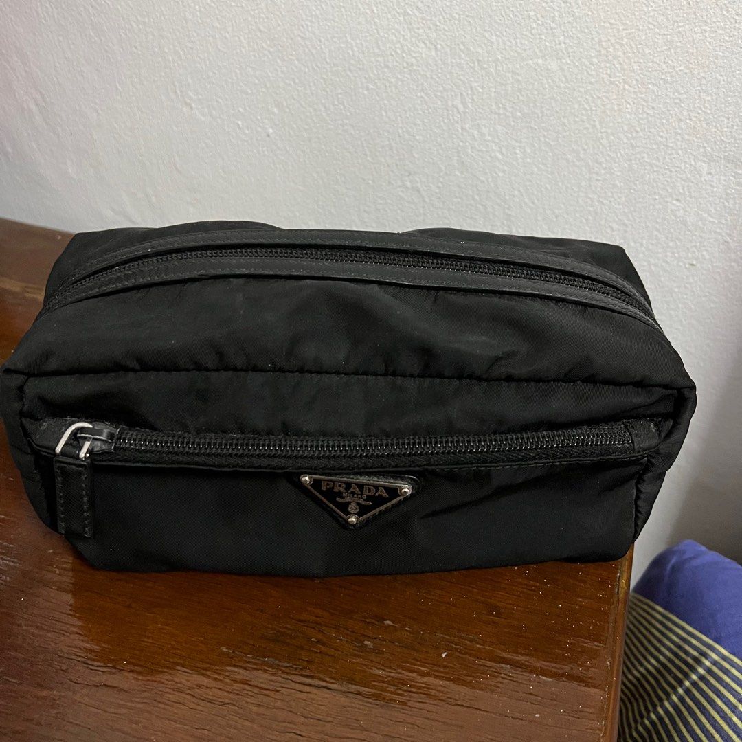 Authentic Prada Nylon Pouch/Clutch (Category: Luxury Bags & Wallets) located in Manila. Submitted by barefinds (Listing ID 1213935698, Image 2). Description: - 💯 Authentic - 💯 Vintage - From Italy - 25 cm x 11 cm - signs of usage, so please manage your expectations - both zipper still working - interior needs cleaning .