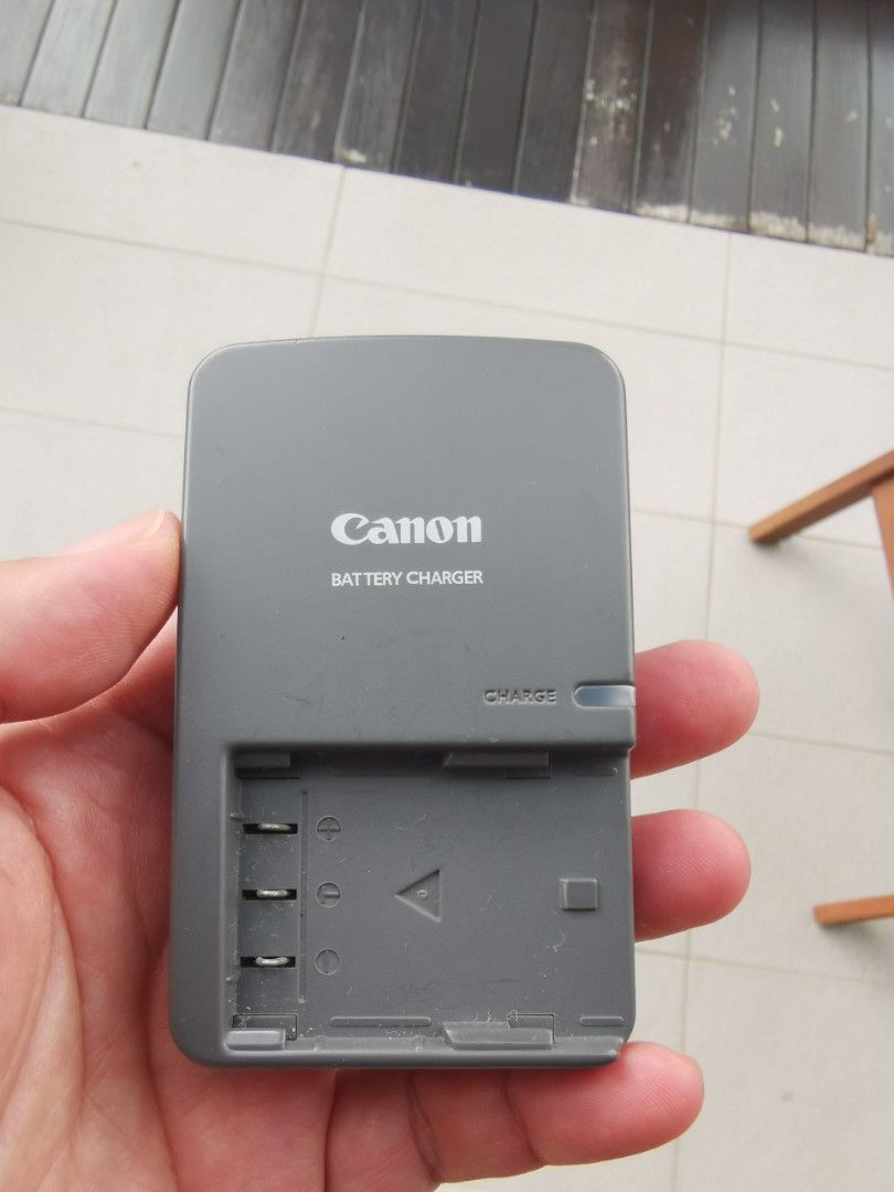 Canon camera battery charger, Photography, Cameras on Carousell