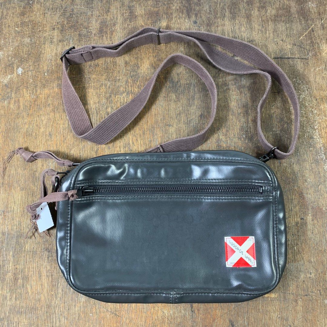 Luggage label outlet sling bag