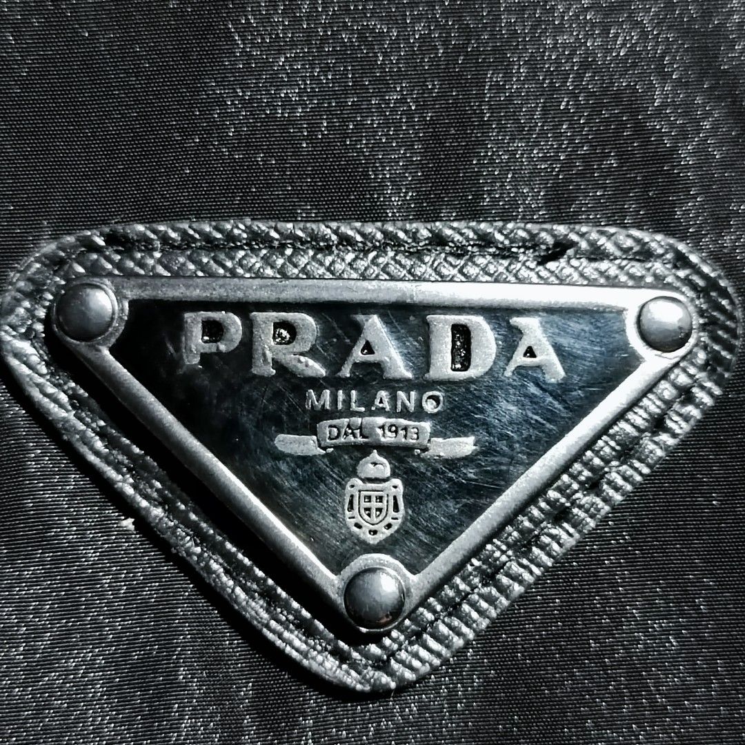 PRADA Metal Logo Jacket, Men's Fashion, Coats, Jackets and Outerwear on  Carousell