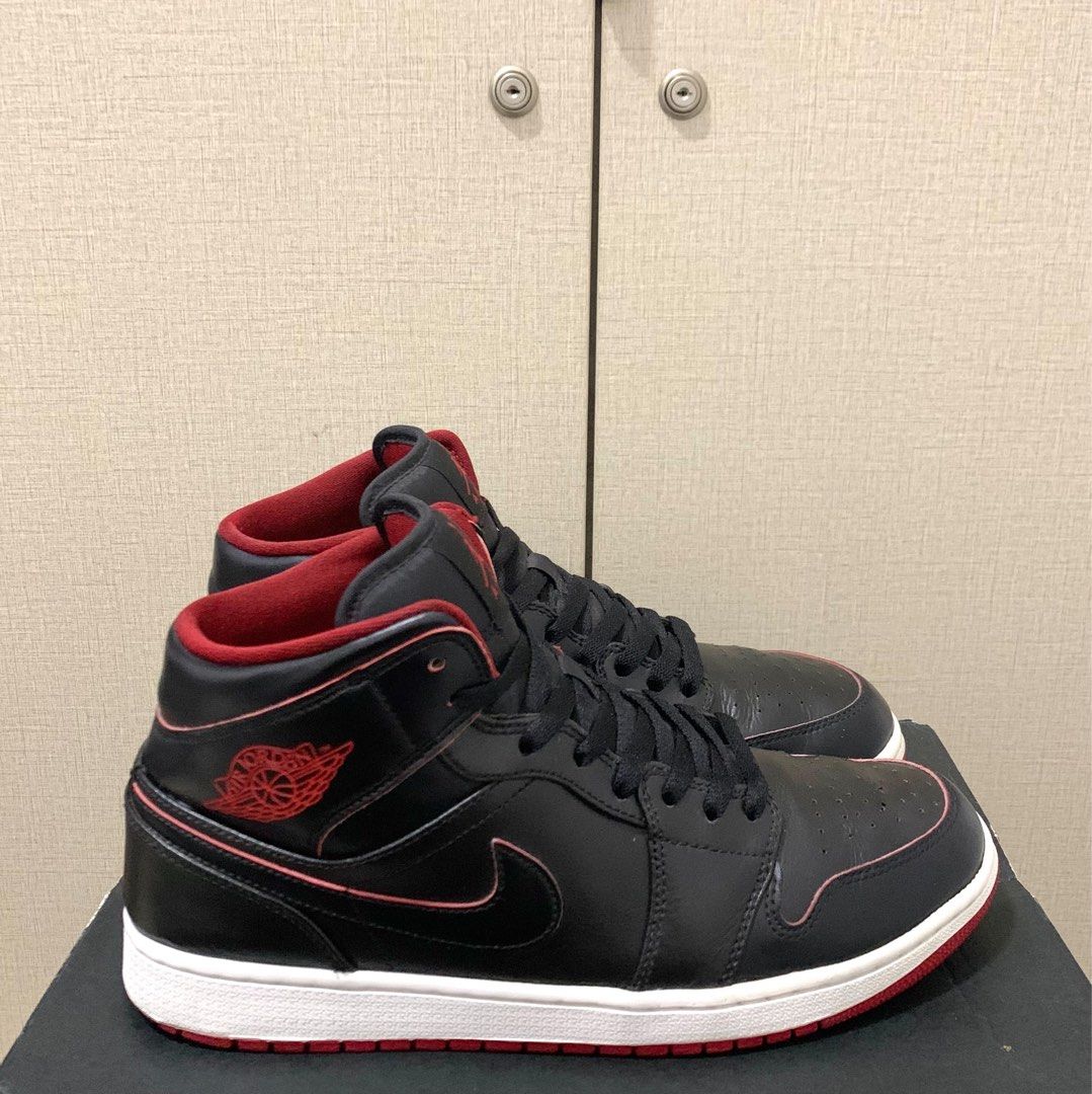 black jordans with red stitching