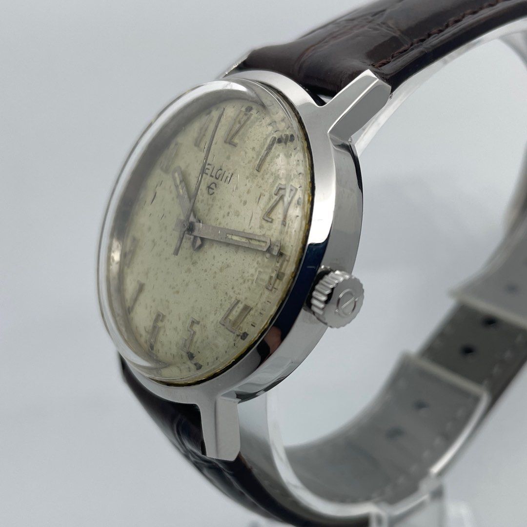 Elgin American Vintage Wind (Category: Men's Watches) located in Manila. Submitted by ozn3rol (Listing ID 1214136279, Image 3). Description: ELGIN American Vintage Hand Wind Case size: 34mm Lug width: 18mm Thickness: 10.5mm Signed Elgin Crown Newly serviced Keeps great time New brown leather strap “During its one-hundred-year history, Elgin produced around 60 million timepieces—ranging from military and pocket watches to exquisite art deco pieces