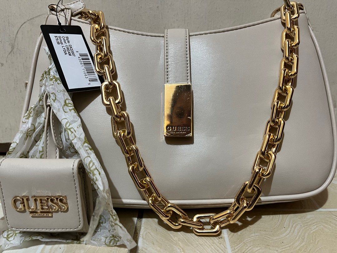 Guess Gold chain shoulder bag (Category: Shoulder Bags) located in Quezon City. Submitted by SafeOnline (Listing ID 1214124293, Image 3). Description: .