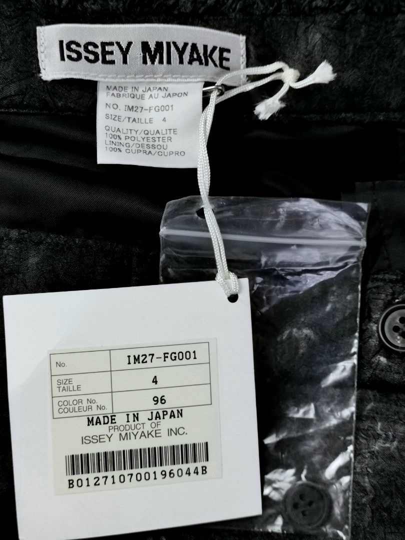 Issey Miyake Textured Maxi Skirt (Category: Luxury Apparel) located in Makati City. Submitted by _collectorschoice_ (Listing ID 1214013322, Image 3). Description: ° Issey Miyake crumple textured skirt is crafted in black polyester ° Brand new with tag (w/ extra button) ° Made in Japan ° Textured finish ° Two toned ° Two side pockets ° Ankle-length ° Fully lined ° Material: 100% polyester ° Ultra soft interior ° 2 Button closure on the side ° Size