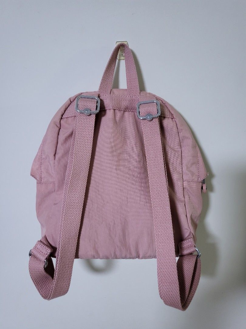 KIPLING backpack (Category: Backpacks) located in Singapore. Submitted by fleurj48 (Listing ID 1214306448, Image 6). Description: Preloved Kipling backpack in bold blush /pink for sale Good condition cos hardly used - Nylon - Dimensions: 8.75"L x 10.75"Н 3.75"D Weight: 0.53 lbs Volume: 6L Top carry handle Adjustable backpack straps Front zip pocket Internal slip pocket Monkey keychain Imported Pm for more details Deal at Marine Parade paynow only