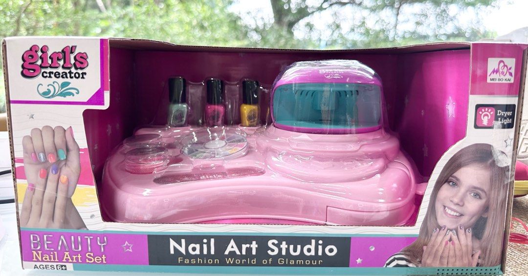 Manicure Set (Category: Kids Toys) located in Singapore. Submitted by mum101 (Listing ID 1214200529, Image 6). Description: Features & details ✿ COMPLETE NAIL KIT: Everything you need to create glitter nail art right at your fingertips. With plenty of sparkle, this kit includes: 1 Nail dryer,1 Storage desk,3 Nail polish,2 Boxes of glitter powder,1 White crayon,1nail file,2 Toe separators,1 Sticky nail gems. It makes a great gift ✿ EASY CLEAN-UP: 