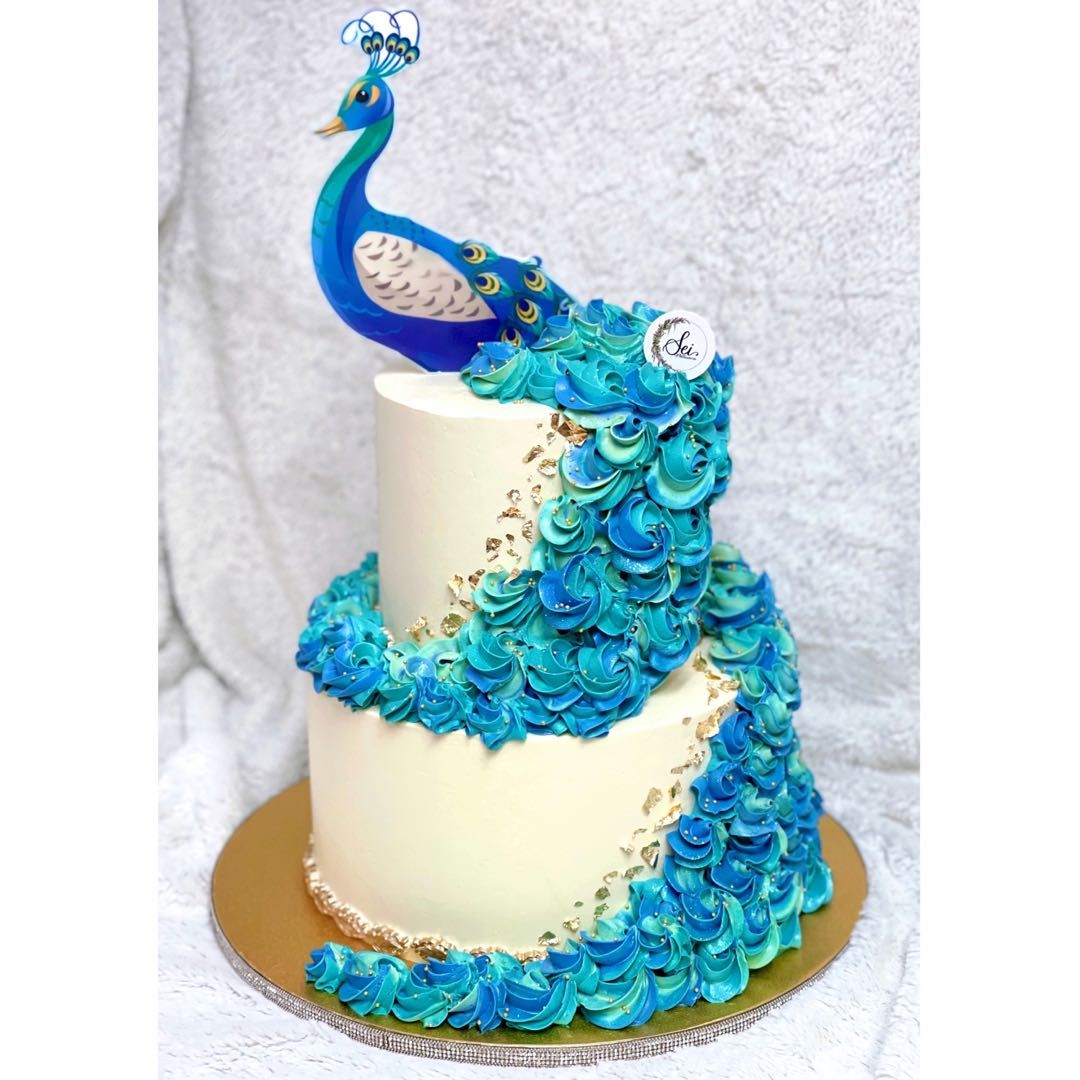 Peacock Themed Cake with Feathers Stock Photo - Alamy