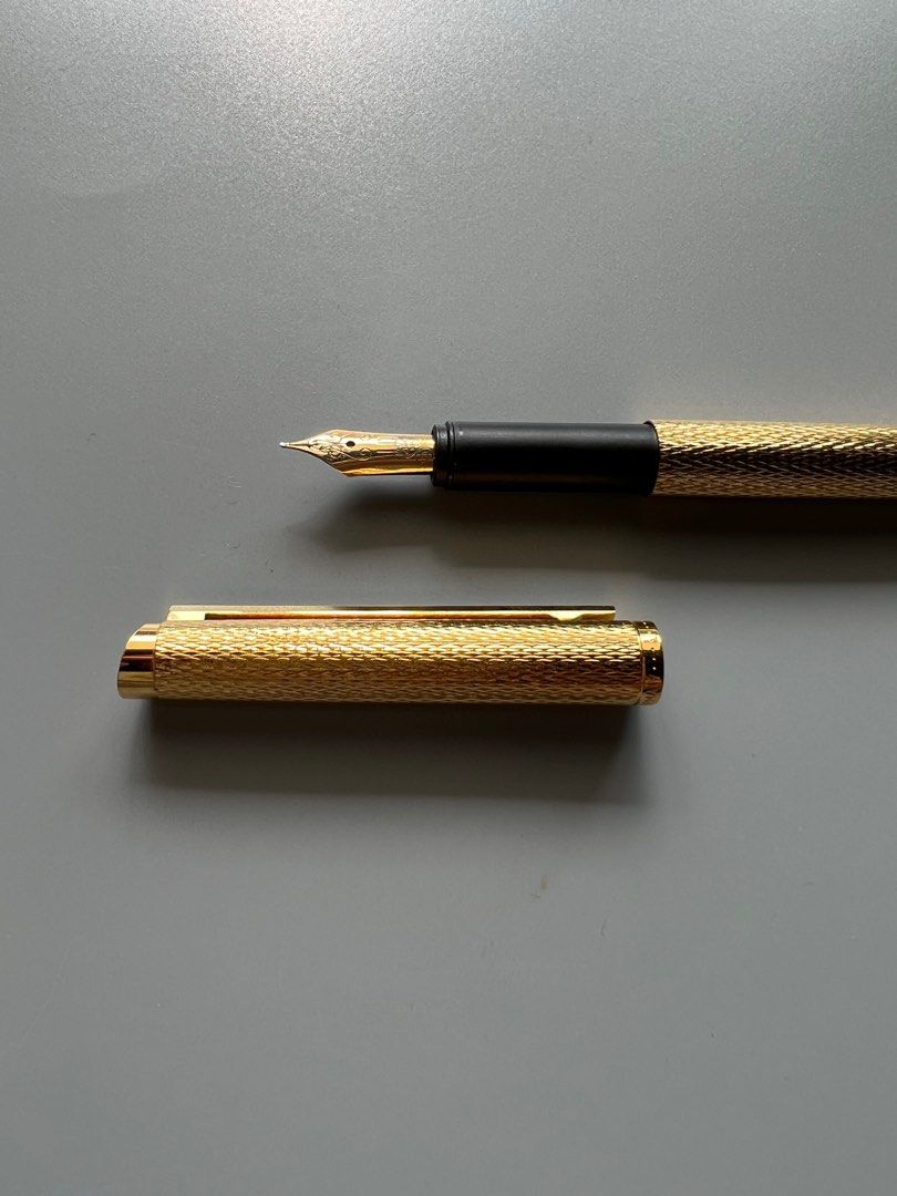 Dunhill Gold Fountain Pen (Category: Luxury Accessories) located in Manila. Submitted by mnlwatchsociety (Listing ID 1219833419, Image 1). Description: Dunhill Gold Plated Fountain Pen 18k gold plated Mint With original box.