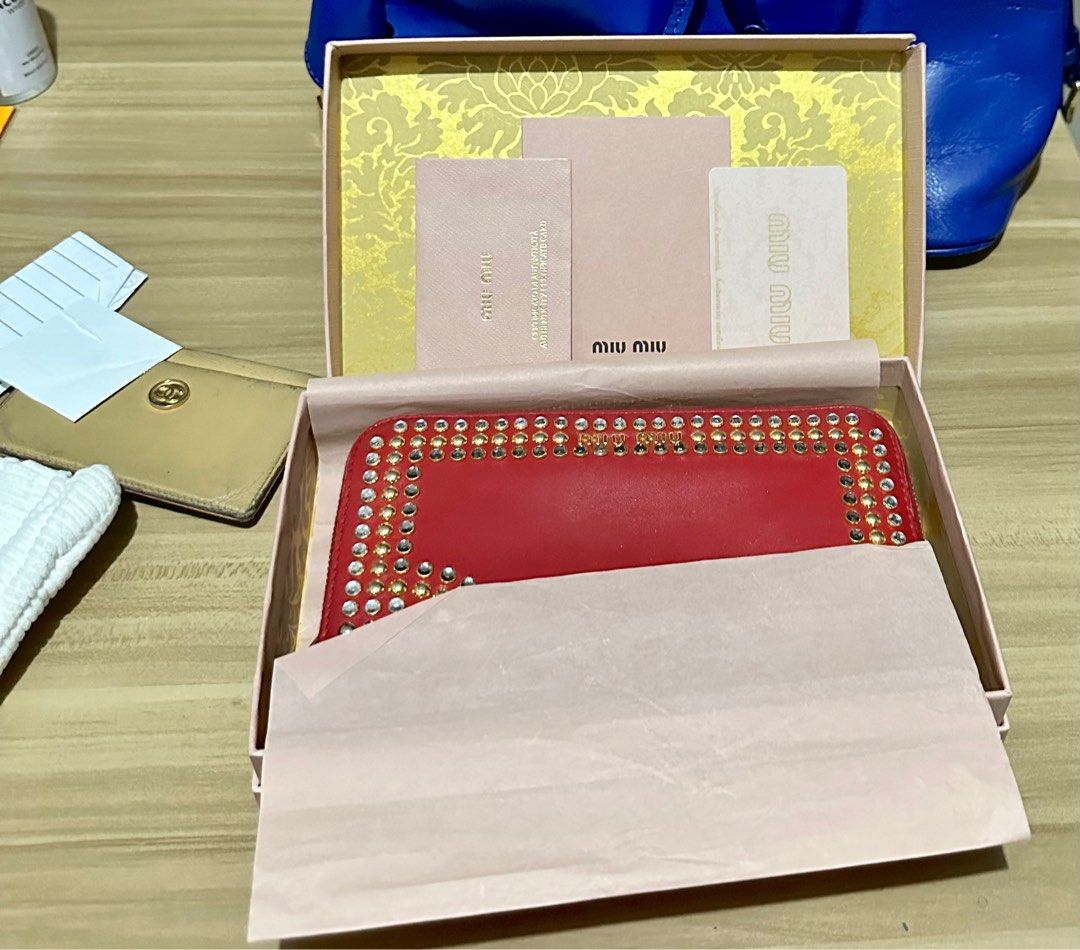Miu Miu (Category: Luxury Bags & Wallets) located in Quezon City. Submitted by lineprelove23 (Listing ID 1219765212, Image 1). Description: Cute MiuMiu Long wallet with stones like Prada design. Prada and MiuMiu are sister company With box and authenticity card.