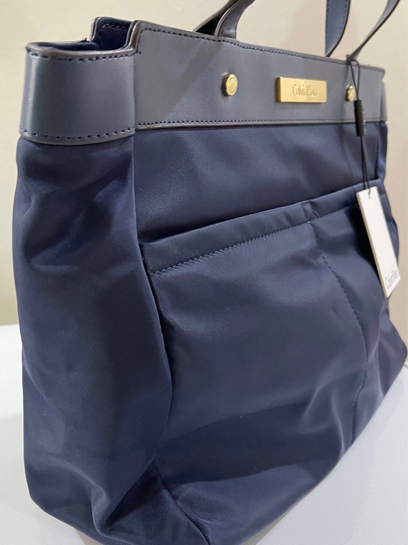 Nylon Navy Blue Shoulder Bag Calvin Klein (Category: Shoulder Bags) located in San Juan City. Submitted by vjncc (Listing ID 1219789089, Image 2). Description: SALE‼️ Brand new with tag and paper bag but stored in cabinet for 2 yrs already. Meant to be given as a gift before pandemic. Good for gifting as tags are intact. Leather intact. ORIGINAL STORE BOUGHT. NOT FAKE NOT OVERUNS NOT PULLOUT ITEM‼️ BUY WITH CONFIDENCE READ REVIEWS. .