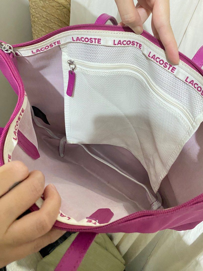 Authentic Lacoste Large Tote Bag (Category: Shoulder Bags) located in Quezon City. Submitted by _ciello21 (Listing ID 1220073226, Image 3). Description: Authentic Fuschia Pink Lacoste Large Tote Bag w/ minimal flaw on handle (check pic for reference) .