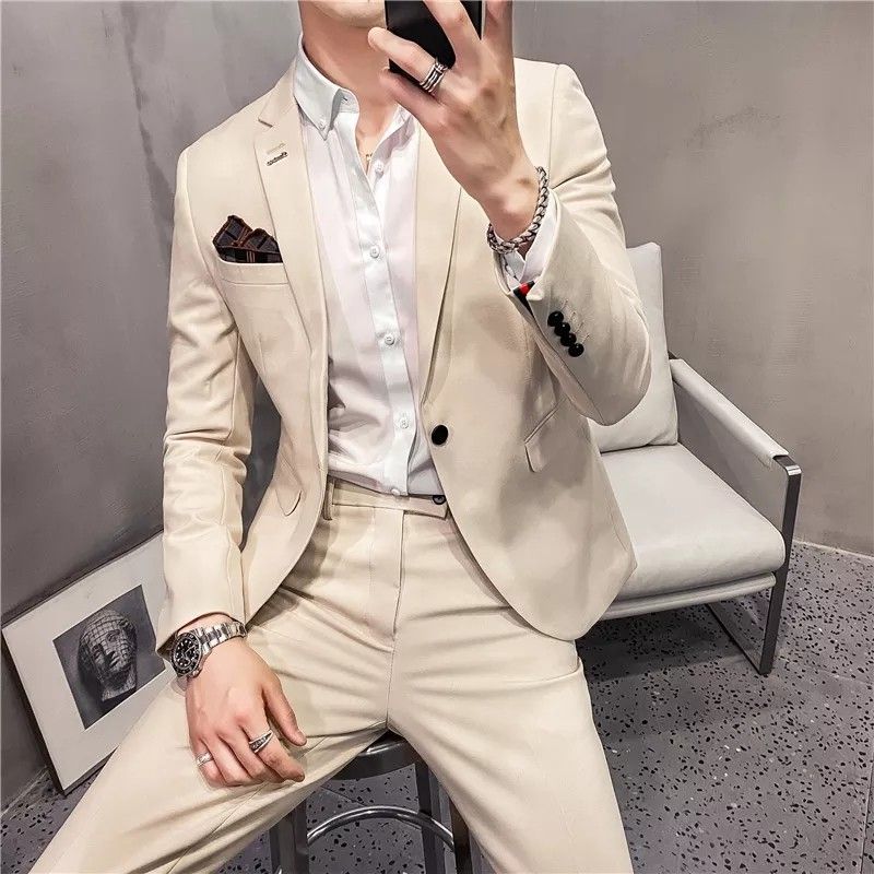 Black suit top beige shirt