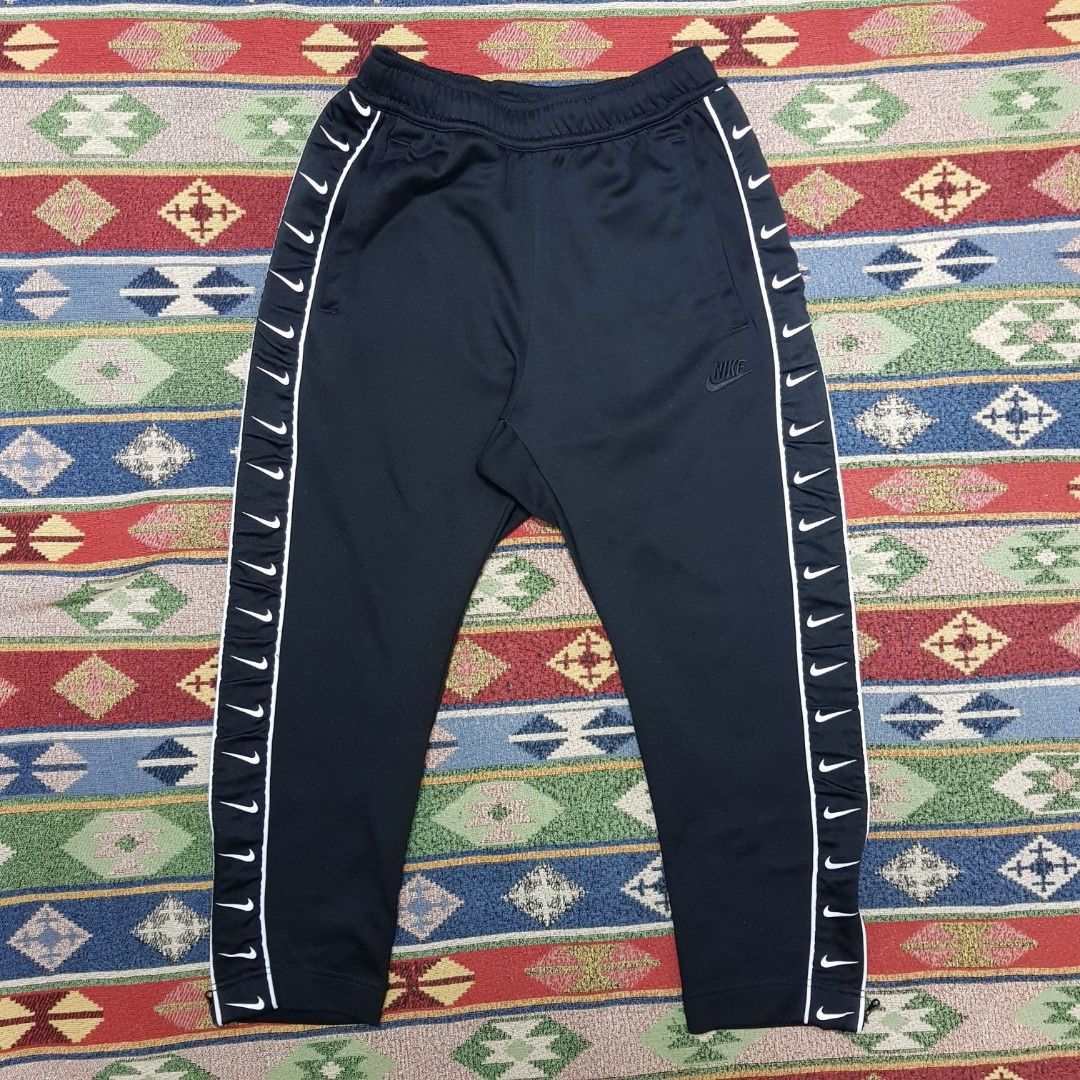 Nike all hot sale over tick joggers