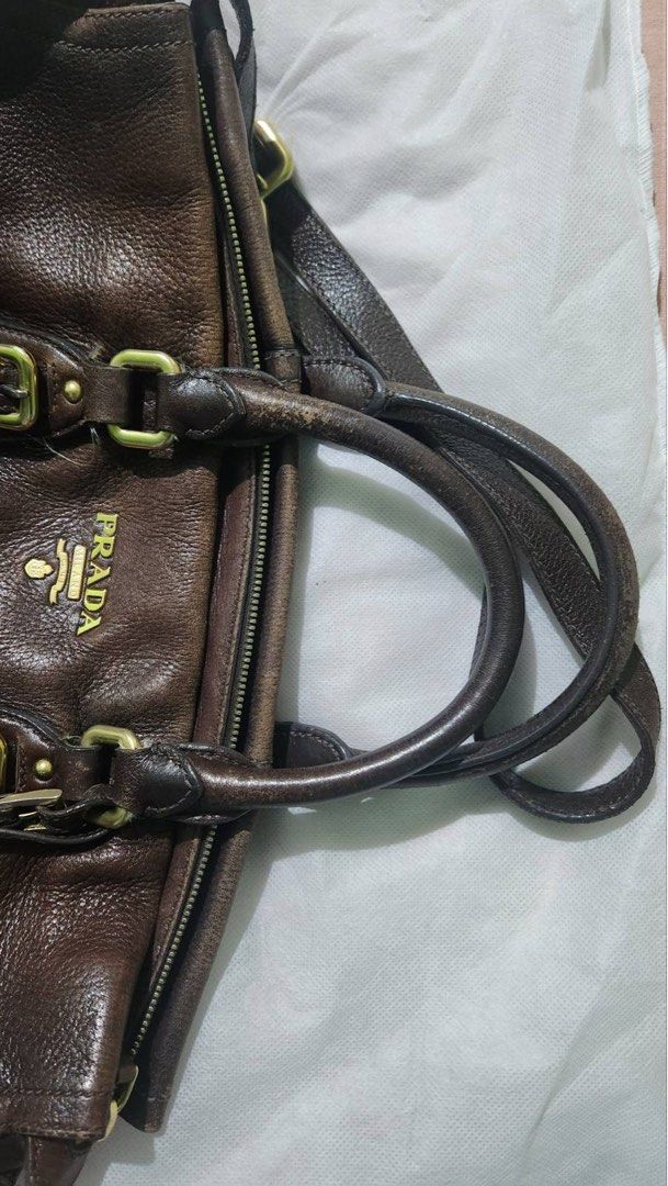 Prada 2way bag (Category: Luxury Bags & Wallets) located in Mandaluyong City. Submitted by amvvg (Listing ID 1219973357, Image 3). Description: Prada 2way strap Dark brown with gold logo Gold hardware Deer leather Guaranteed authentic P12,000 For pickup from Mandaluyong c/o buyer.