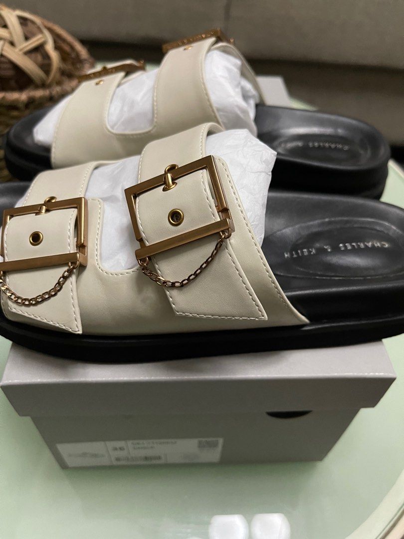 Charles & Keith Chain-Link Buckled Slide Sandals (Category: Flats & Sandals) located in Taguig. Submitted by fftshp (Listing ID 1220237004, Image 2). Description: Original Charles & Keith Sandals (Ordered on Official Website) Size: 36 Color: Chalk RFS: Too small for me Note: Used twice, with minimal side creases due to usage. Slightly negotiable..