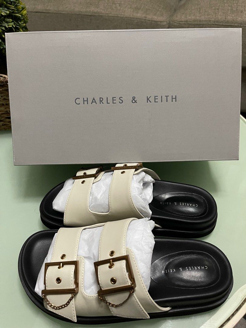 Charles & Keith Chain-Link Buckled Slide Sandals (Category: Flats & Sandals) located in Taguig. Submitted by fftshp (Listing ID 1220237004, Image 3). Description: Original Charles & Keith Sandals (Ordered on Official Website) Size: 36 Color: Chalk RFS: Too small for me Note: Used twice, with minimal side creases due to usage. Slightly negotiable..