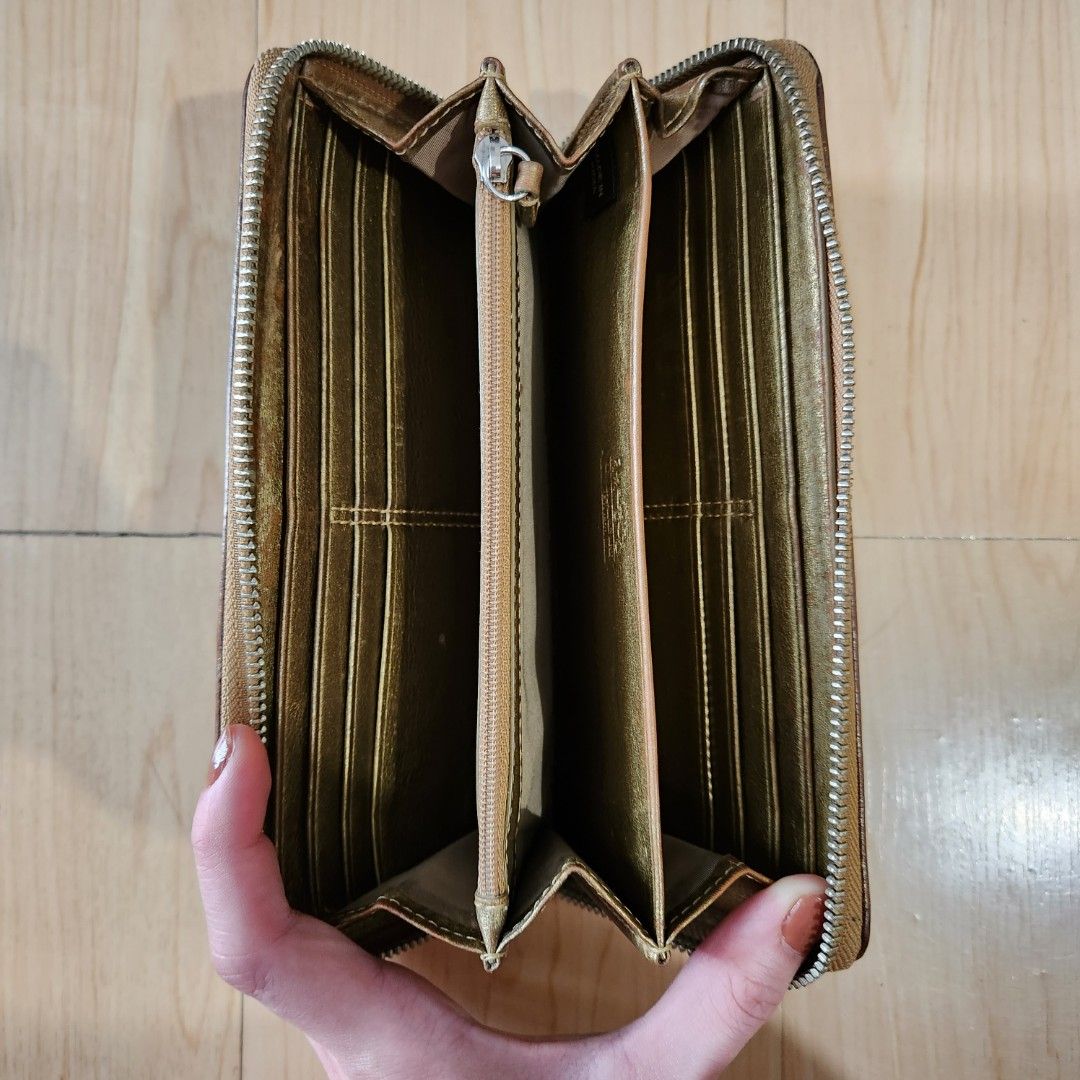 Coach Long Zip Wallet Canvas Khaki (Category: Wallets & Card holders) located in Pasig City. Submitted by mariaspreloved (Listing ID 1220129123, Image 2). Description: coach vintage long zip wallet canvas khaki with gold snake leather details 9/10 condition only issue, replaced zipper.