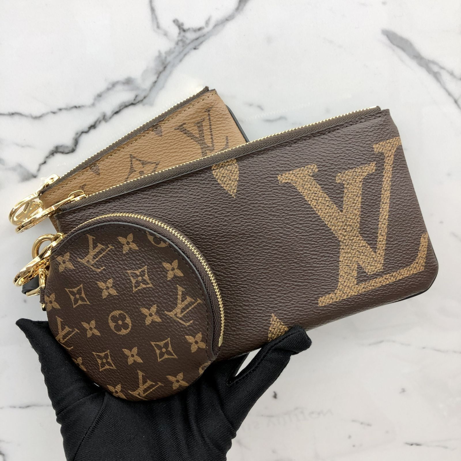 Louis vuitton giant reverse mini monogram trio pouch top