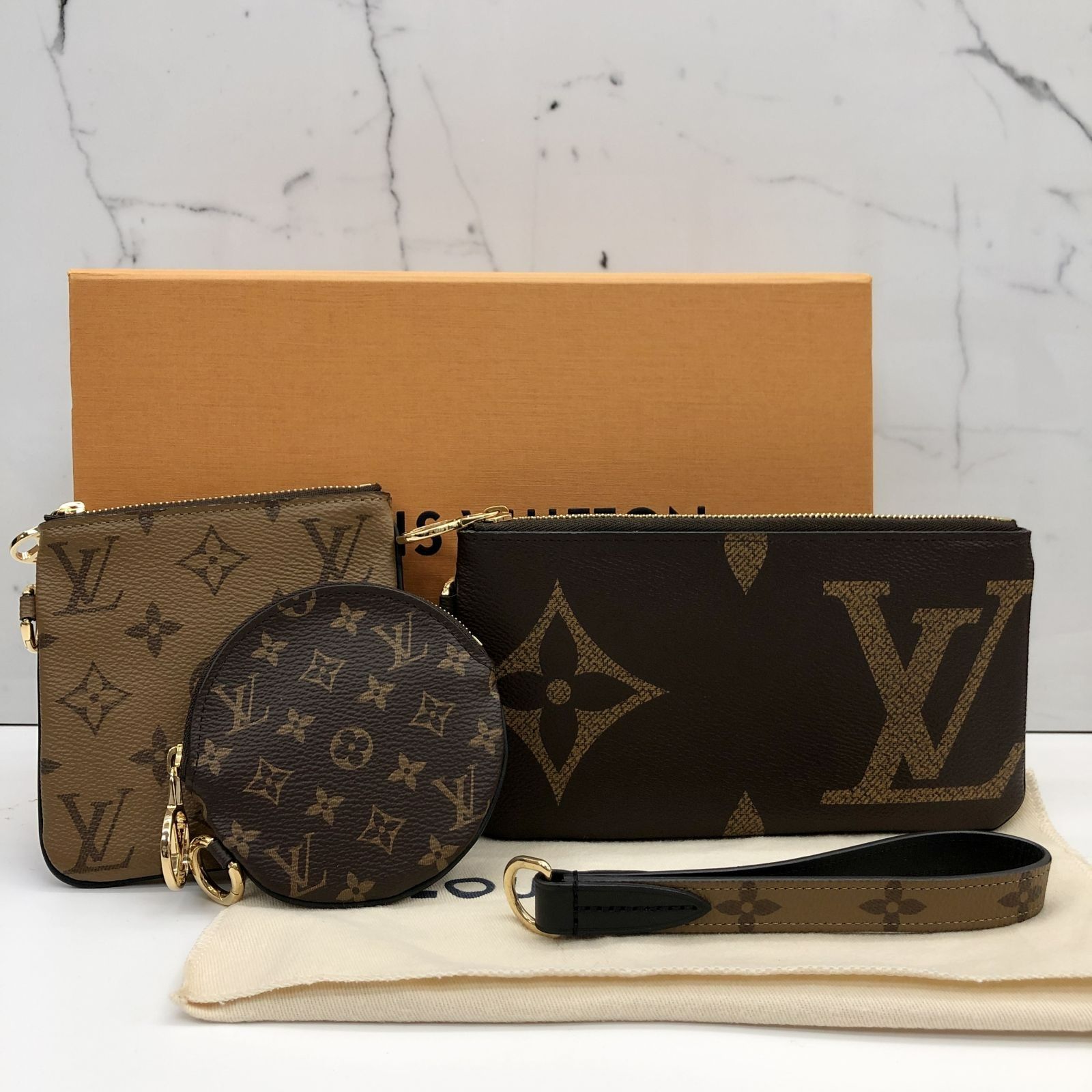 Louis vuitton giant reverse best sale mini monogram trio pouch