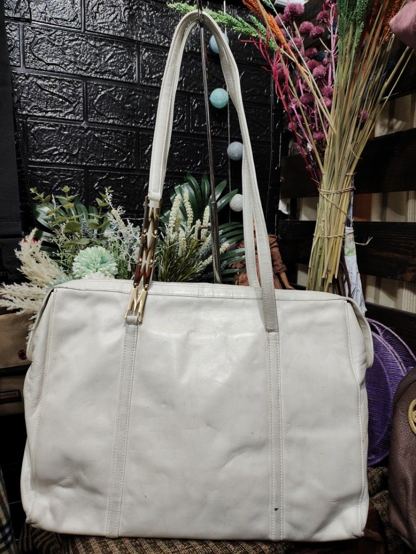 Moschino Vintage Leather Tote Bag (Category: Luxury Bags & Wallets) located in Baguio. Submitted by PreiLoveMaria (Listing ID 1220306739, Image 2). Description: Moschino Vintage Leather Tote Bag Good used conditions Normal signs of wear Needs cleaning only Large Tote Kindly check individual photos for deets 🙂 Shipping via J&T onLy No COD/COP.
