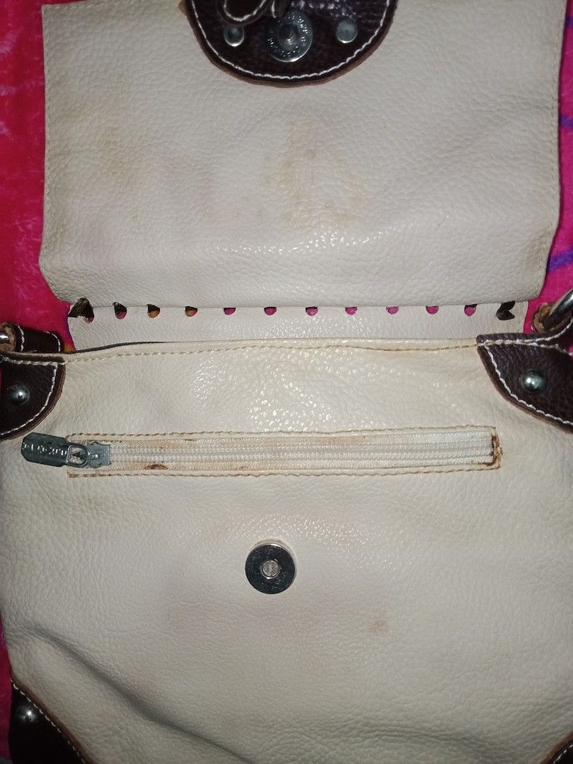 Original Authentic Vintage Prada Bag (Category: Luxury Bags & Wallets) located in Caloocan City. Submitted by kaiksa (Listing ID 1220194043, Image 2). Description: - may stains lang kasi di nagagamit (barely noticeable kasi nasa loob tas brown naman siya) pero wala naman punit or bakbak - leather - bought from Riyadh, K.S.A - pay first! pay thru gcash -negotiable - sf should be shouldered by the buyer - negotiable.