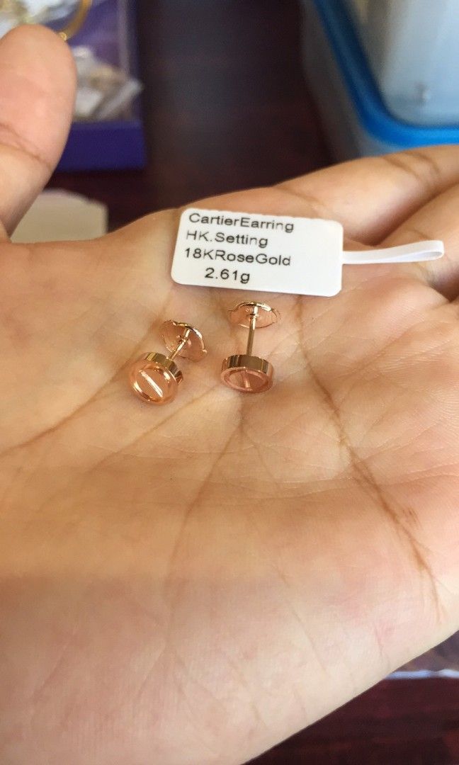 Cartier gold stud earrings top