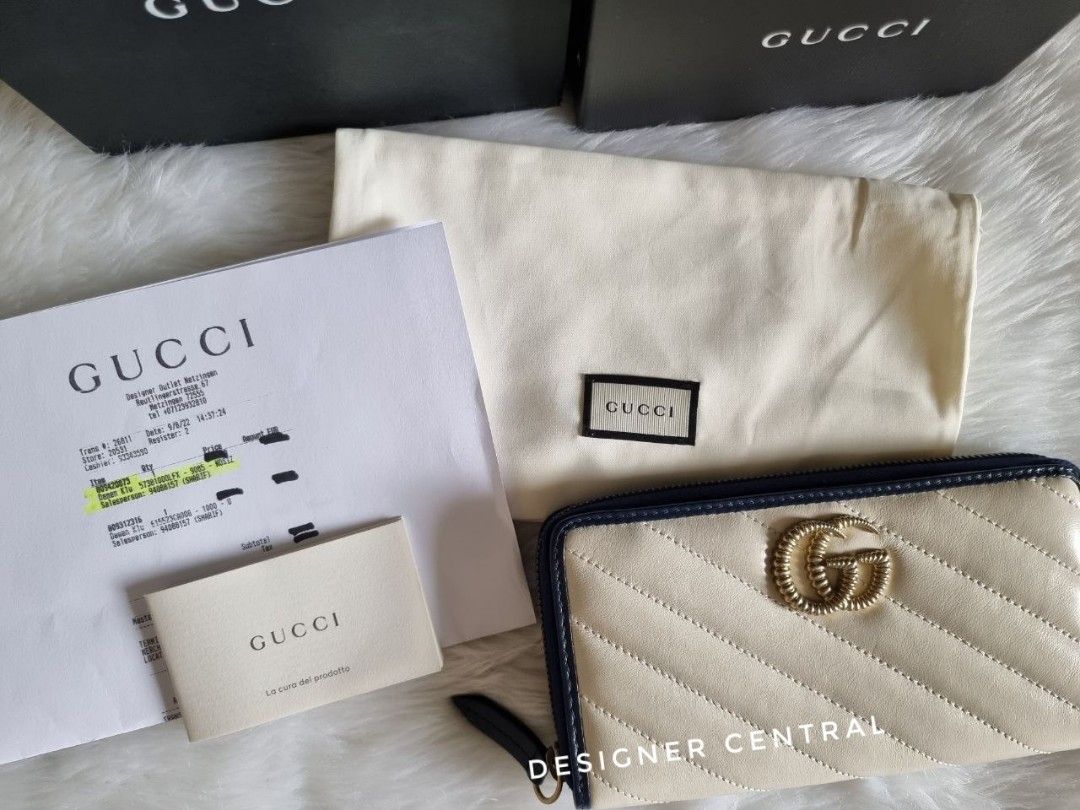 Gucci GG Marmont Zip Around Wallet (Category: Wallets & Card holders) located in Taguig. Submitted by designer.central (Listing ID 1220347302, Image 2). Description: Gucci GG Marmont Zip Around Wallet • White diagonal matelassé quilted leather • Twisted torchon Double G embellishment • Outlined in contrast dark blue piping • Zipper closure with elongated zipper puller • Bill compartments divided by a partition • Zip coin pocket • 12 card slots • 