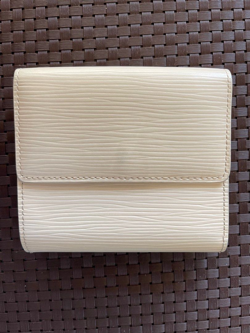 Louis Vuitton Epi Leather Trifold Wallet (Category: Luxury Bags & Wallets) located in Paranaque City. Submitted by shopjmac (Listing ID 1220358826, Image 3). Description: White LV trifold wallet in Epi leather 6 card slots + 2 interior pockets 1 Bill compartment Snap closure coin purse .