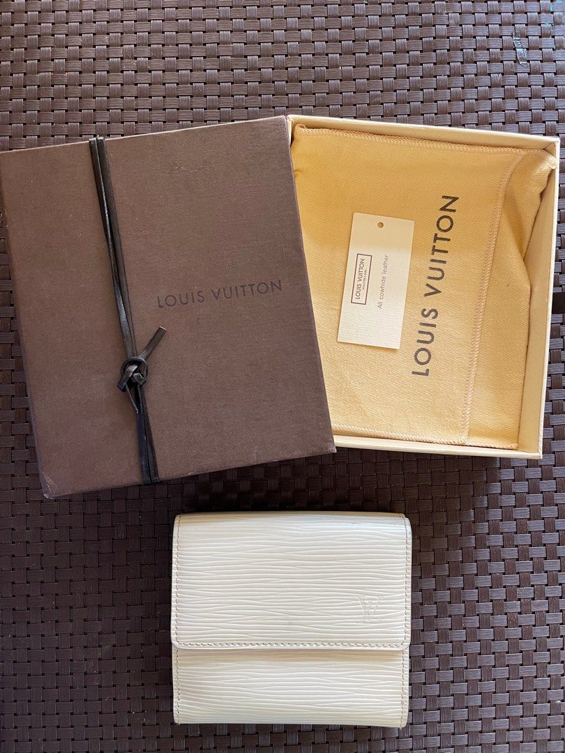 Louis Vuitton Epi Leather Trifold Wallet (Category: Luxury Bags & Wallets) located in Paranaque City. Submitted by shopjmac (Listing ID 1220358826, Image 1). Description: White LV trifold wallet in Epi leather 6 card slots + 2 interior pockets 1 Bill compartment Snap closure coin purse .