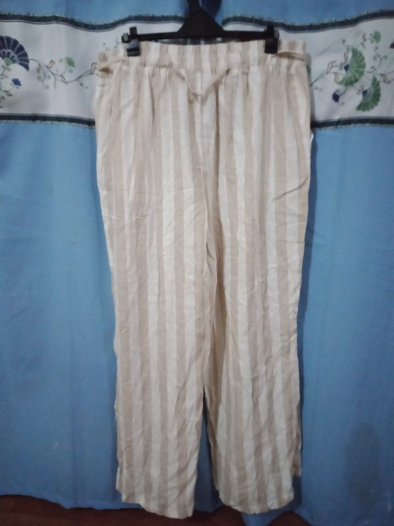 Nude and White Stripe Straight Cut (Category: Other Bottoms) located in Paranaque City. Submitted by _andreaaaa13 (Listing ID 1220503788, Image 3). Description: Rockmans - Has stain on the back part but not really noticable and can be removed by washing. - Have buttons design each pocket. - Have slit both legs. - Can fit to L to XL..