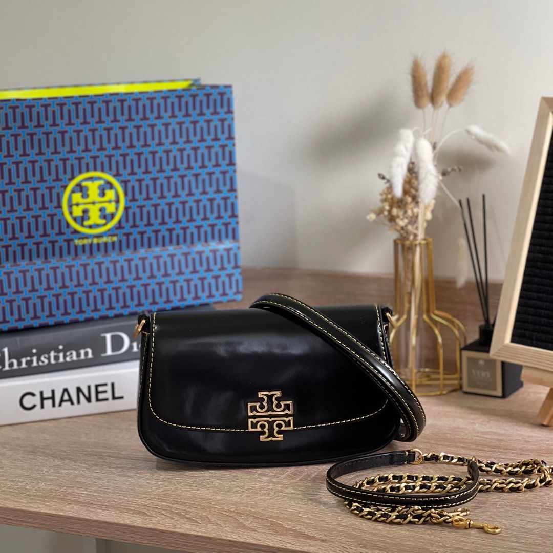 PREORDER: Tory Burch Britten Convertible Saddle Bag (Category: Cross-body Bags) located in Pasig City. Submitted by lizredclosetph (Listing ID 1220513943, Image 1). Description: Tory Burch Britten Convertible Saddle Bag Brandnew with complete inclusion 2weeks eta.