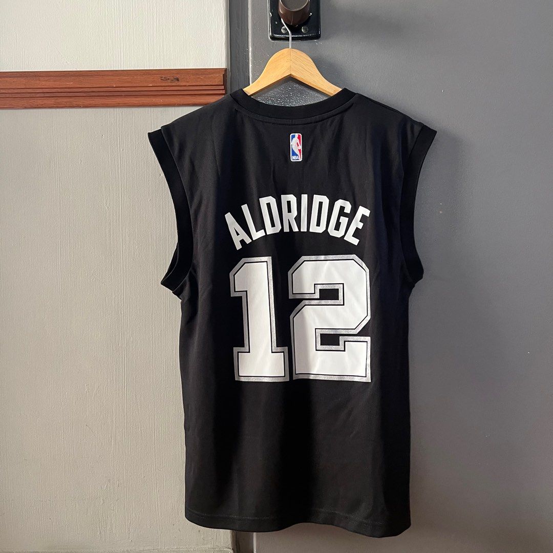 [BNWT] NBA Spurs Aldridge Jersey (Category: Activewear) located in Singapore. Submitted by sebastian.cheng.75 (Listing ID 1220684871, Image 2). Description: Buy more than two pieces for lower price! - Authentic - RFS: Clearing wardrobe - Condition: Brand new with tag, unworn Self-collect preferred! Meet-up also ok but location at my convenience, can be discussed! :) Open for nego too..