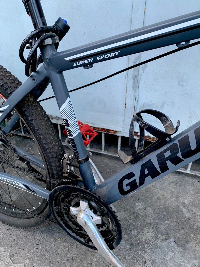 Garuda Mountain Bicycle (Category: Bicycles) located in Quezon City. Submitted by maria16_ (Listing ID 1220615431, Image 3). Description: 🚴 BICYCLE FOR SALE (RUSH)‼️ P5,400 ~ negotiable price for sure buyer Brand: Garuda Size: 27 🛑 Shimano shifter 🛑 Upgraded pedal 🛑 All accessories in the picture are included 🛑 With freebie sports bottle Colors: Grey and black Purchased on: January 2023 RFS: For hospital bills Issue/s: Very minimal scratches
