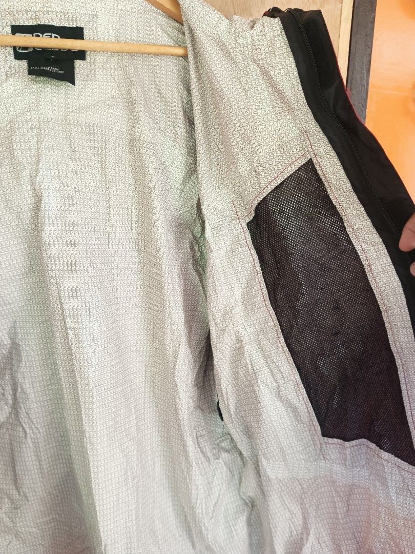 Red ledge rain jacket on carousell