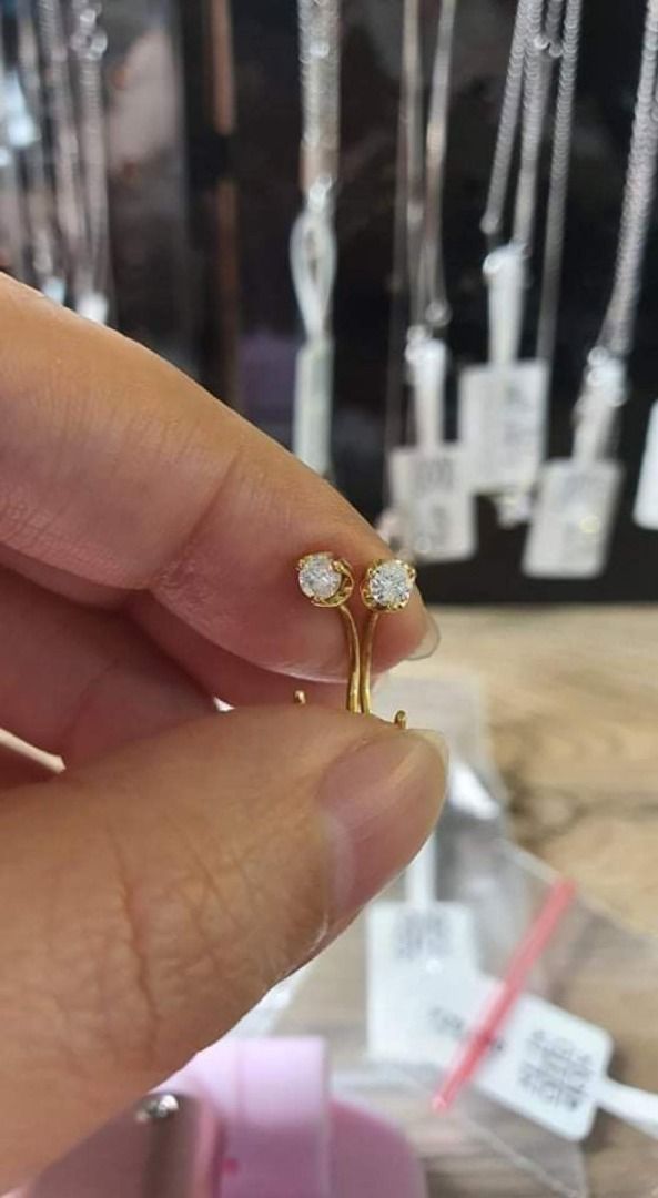 diamond earrings 2-way (Category: Earrings) located in Quezon City. Submitted by rishlist (Listing ID 1220775841, Image 2). Description: - 2 way: stud or dangling - 0.20 cts, SI clarity, F color - 18k yg - used 3x only - no certificate, jeweller can vouch for it, pwede din po ipatingin sa gemologist :) - price negotiable - can send you more pics if interested.