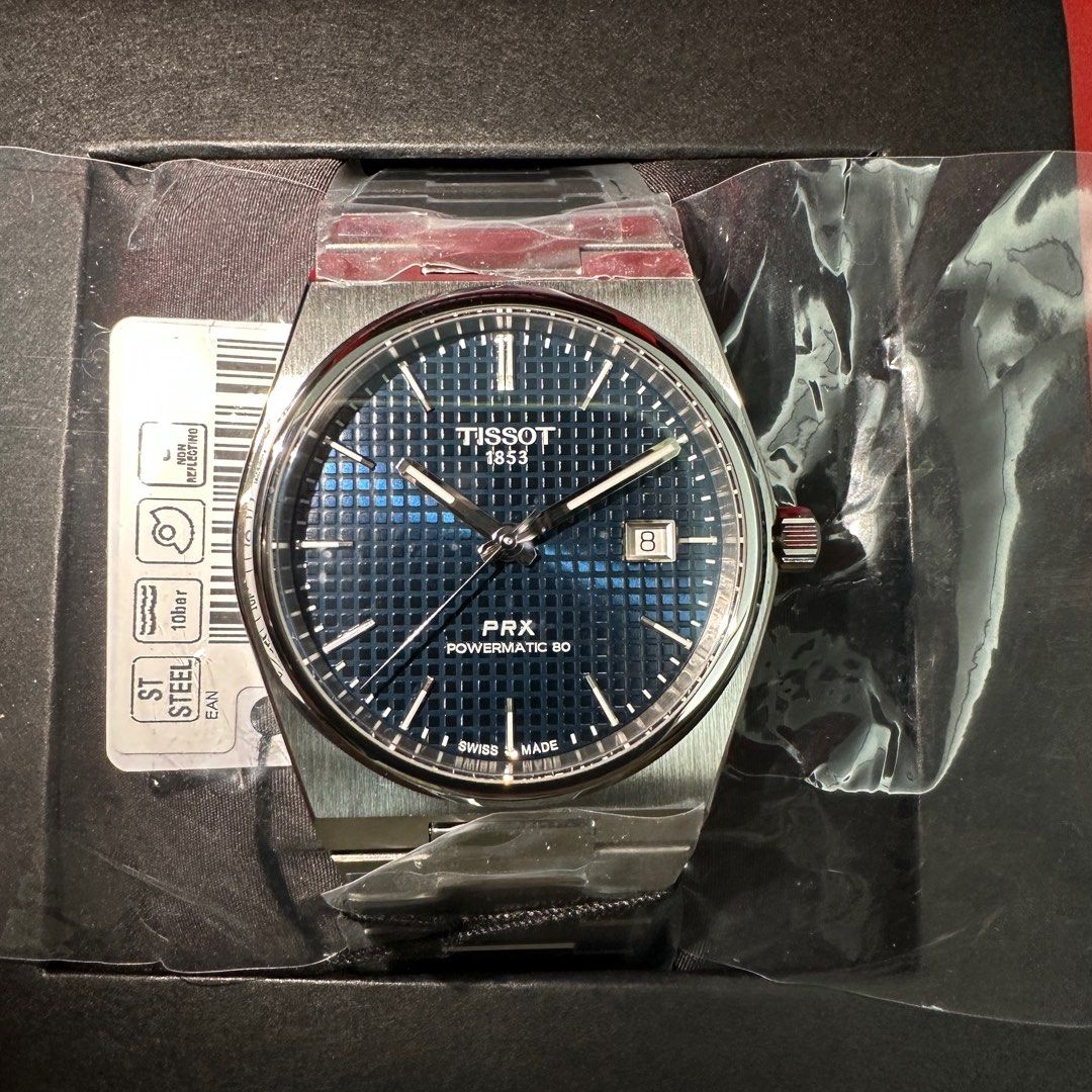 2023 Tissot PRX Powermatic 80 Blue (Category: Luxury Watches) located in Makati City. Submitted by grail_luxury (Listing ID 1221077599, Image 2). Description: Brand New 2023 TISSOT PRX Powermatic 80 Blue Tapisserie Dial ref. T137.407.11.041.00 UNWORN UNRESIZED COMPLETE INCLUSIONS Stickers still intact Diameter: 40mm Thickness: 10.9mm Movement: Powermatic 80.11.