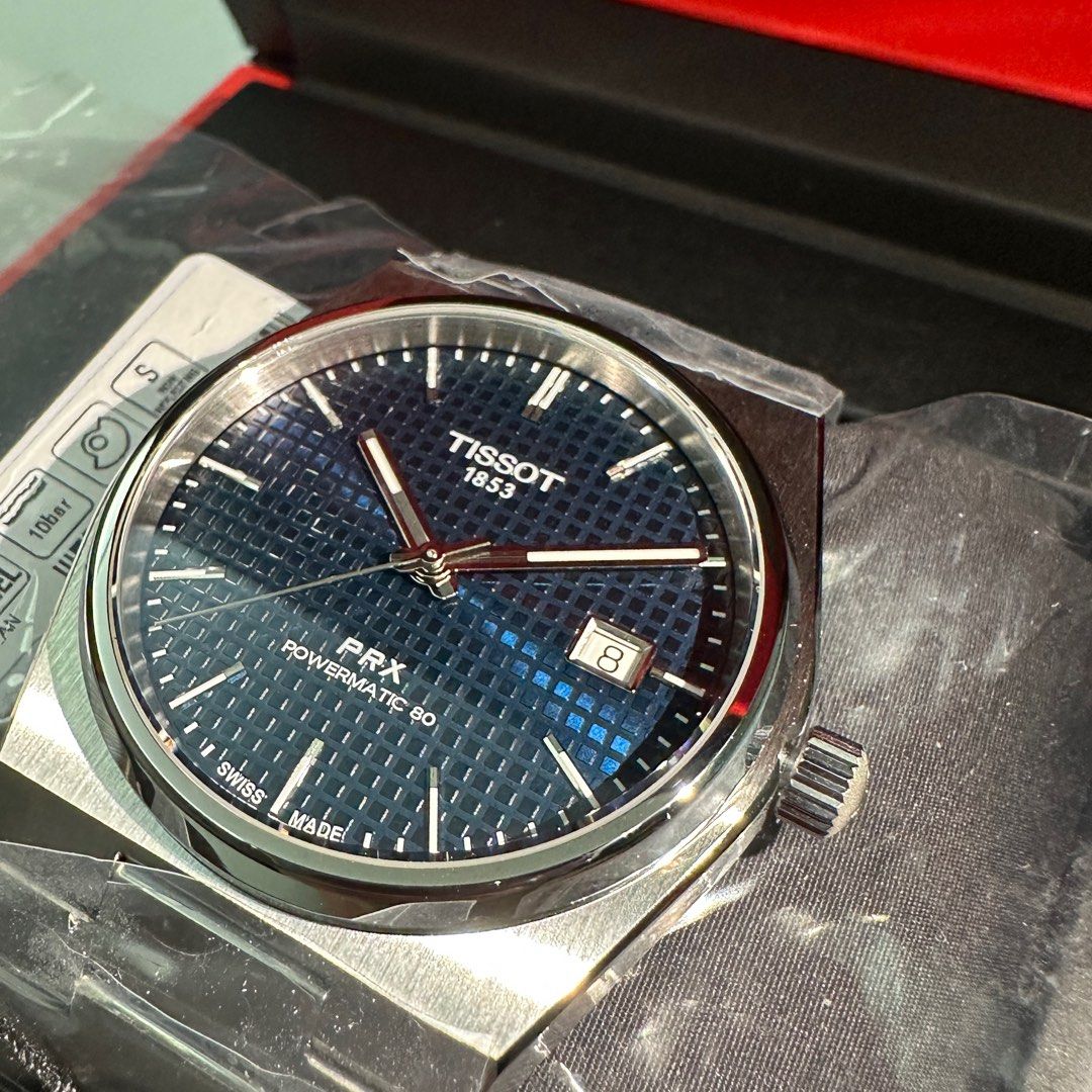 2023 Tissot PRX Powermatic 80 Blue (Category: Luxury Watches) located in Makati City. Submitted by grail_luxury (Listing ID 1221077599, Image 3). Description: Brand New 2023 TISSOT PRX Powermatic 80 Blue Tapisserie Dial ref. T137.407.11.041.00 UNWORN UNRESIZED COMPLETE INCLUSIONS Stickers still intact Diameter: 40mm Thickness: 10.9mm Movement: Powermatic 80.11.