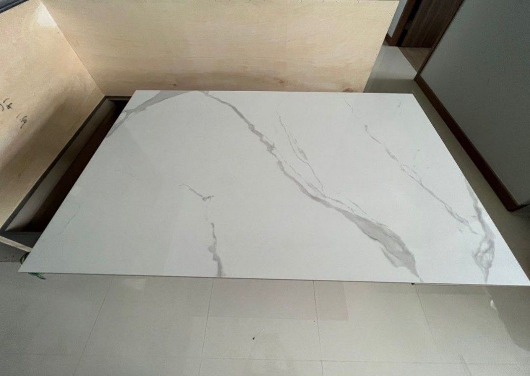 Dining Table (Category: Tables & Sets) located in Singapore. Submitted by t.chinwoon (Listing ID 1221050871, Image 1). Description: selling brand new marble dining table due to purchased wrongly cannot fit to my dining area. Only one side can be extend out. Dimension-L140cm extend tp L170com Thickness-6mm Width-90com Height-75cm self collect at my place,delivery if u buy the courier fee.